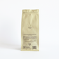 yellow coffee bag with text on a white background